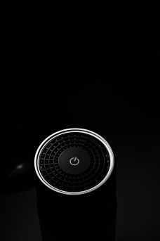 A speaker with a power button.